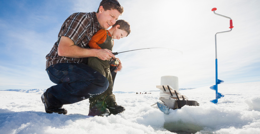 Father and son ice fishing